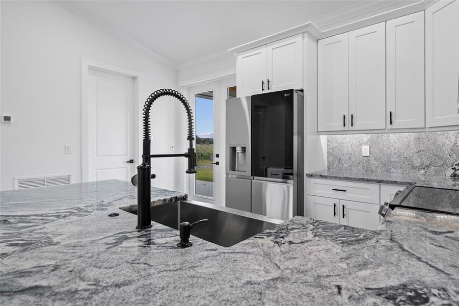 Furnished interior view inside a new home in , Okeechobee (Image 9).