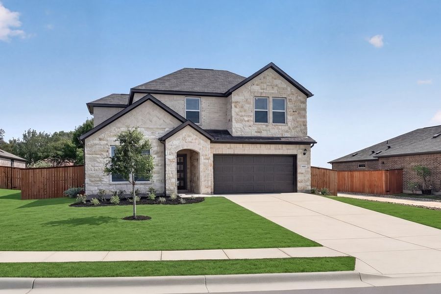 Front exterior of a new home in Lisso, Pflugerville, TX, highlighting curb appeal (Image 2). Front exterior of a new home in Lisso, Pflugerville, TX, highlighting curb appeal (Image 2).