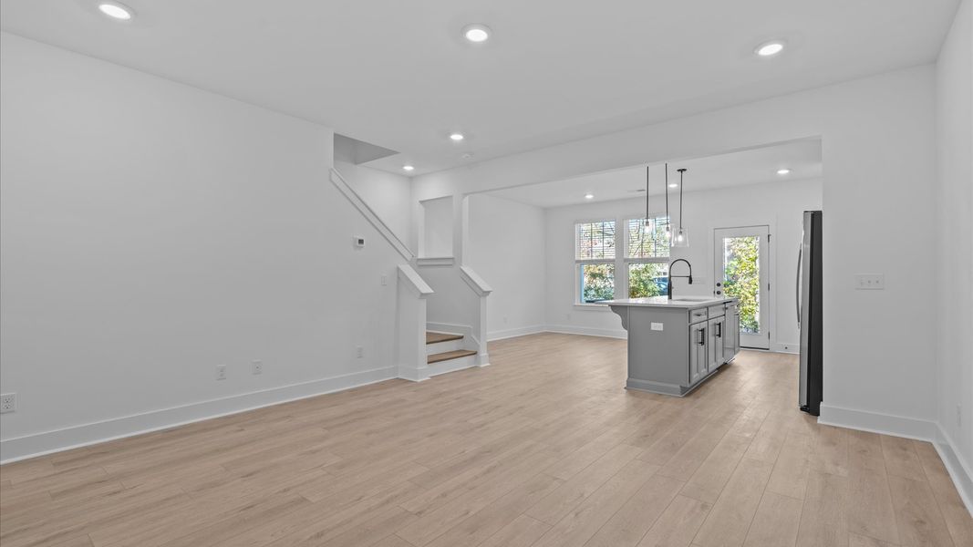 Hardwood flooring and high standards define this vibrant family room ideal for everyday living