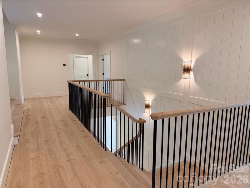 Upstairs landing connecting four bedrooms, laundry room and media room.