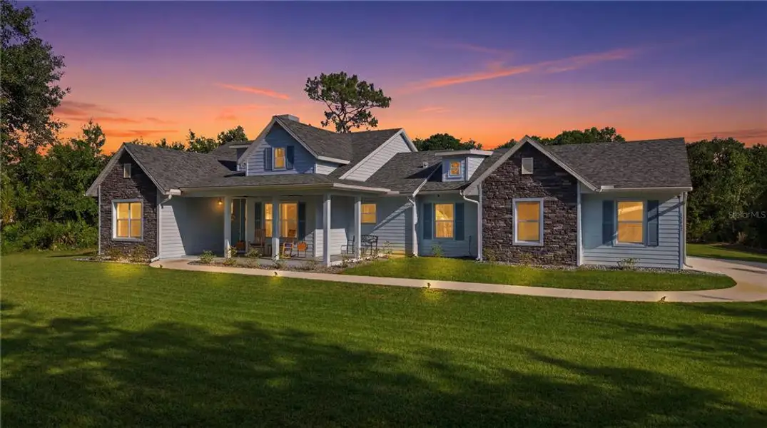 Front exterior of a new home in , Wesley Chapel, FL, highlighting curb appeal (Image 1). Front exterior of a new home in , Wesley Chapel, FL, highlighting curb appeal (Image 1).