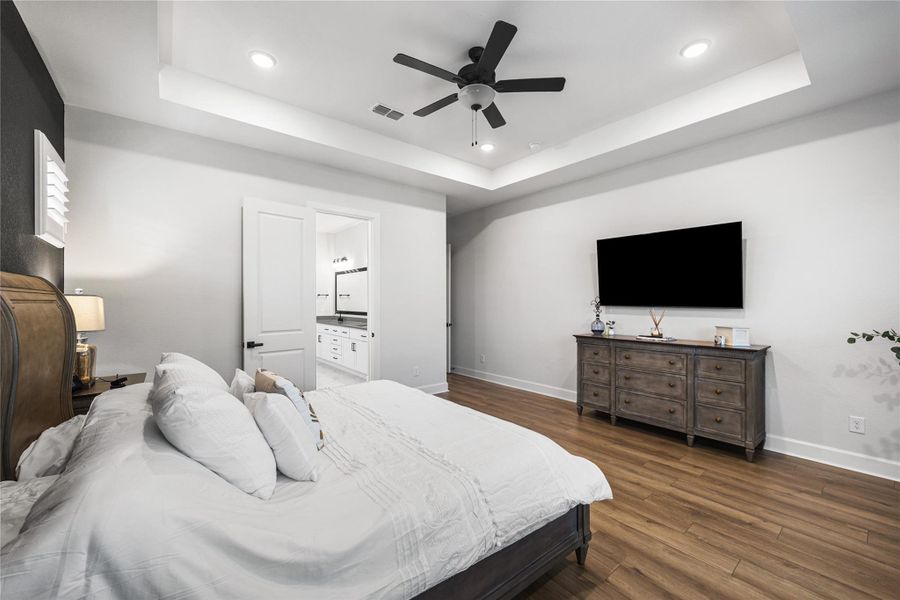 Well-appointed laundry room with built-in cabinetry, a convenient drop-off area, and dedicated folding space.