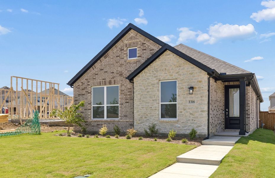 Front exterior of a new home in Pinnacle at Legacy Hills, Celina, TX, highlighting curb appeal (Image 1). Front exterior of a new home in Pinnacle at Legacy Hills, Celina, TX, highlighting curb appeal (Image 1).