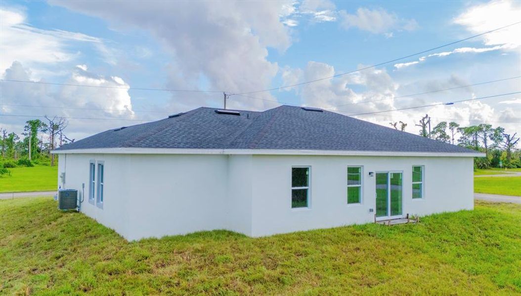 Front exterior of a new home in , Placida, FL, highlighting curb appeal (Image 25). Front exterior of a new home in , Placida, FL, highlighting curb appeal (Image 25).