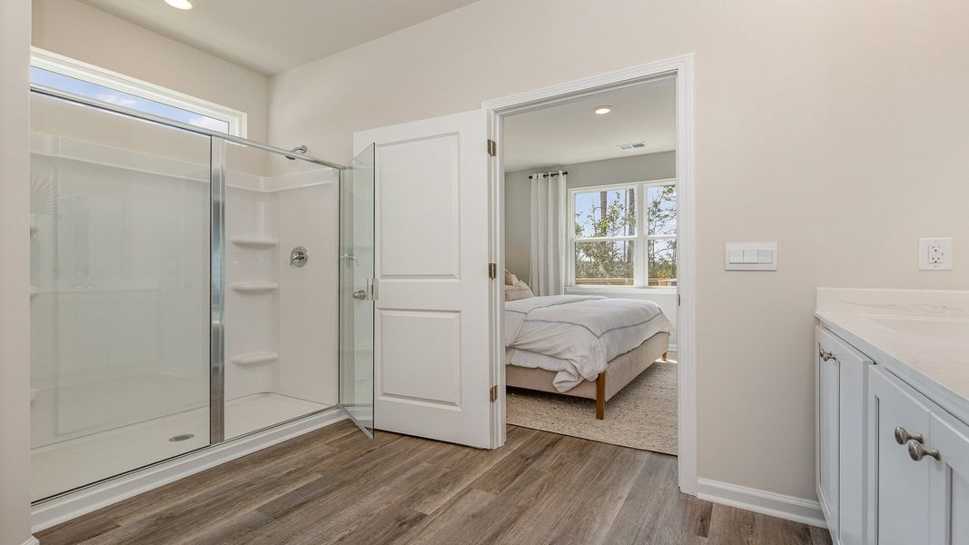Furnished interior view inside a new home in Rich Square at Brunswick Plantation, Ash (Image 16).