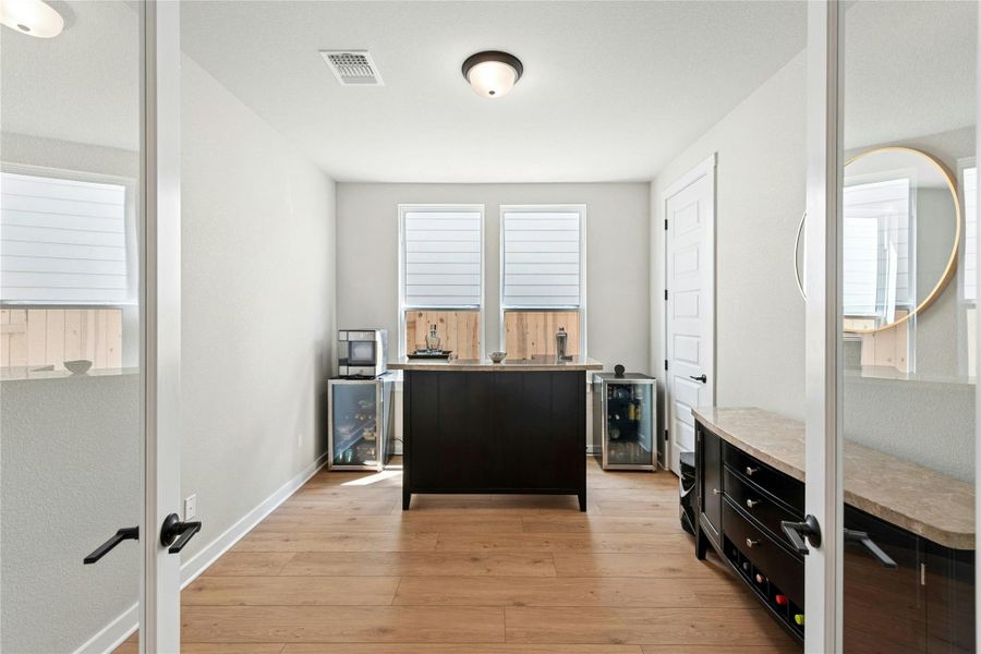 Large office with french doors and windows