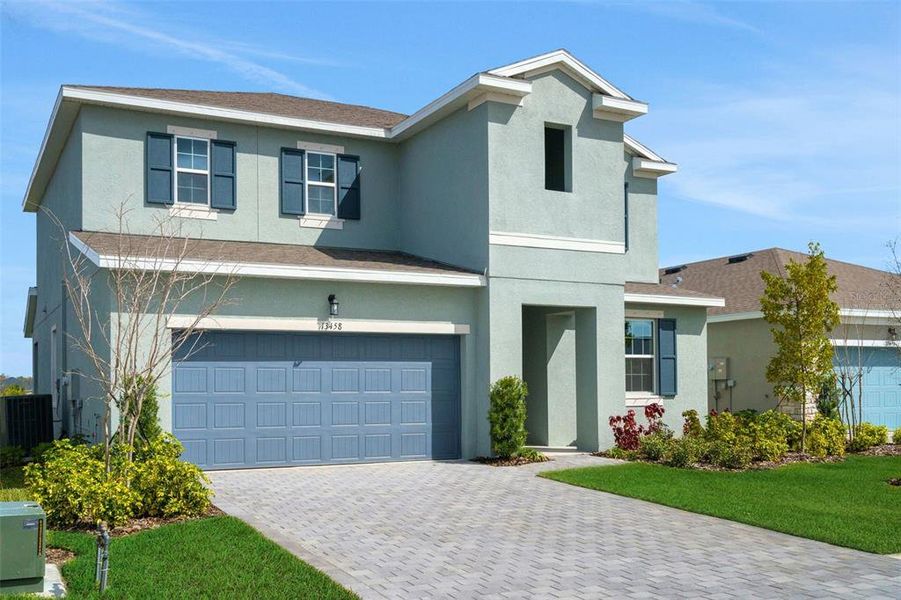 Front exterior of a new home in Turnleaf, Punta Gorda, FL, highlighting curb appeal (Image 23). Front exterior of a new home in Turnleaf, Punta Gorda, FL, highlighting curb appeal (Image 23).