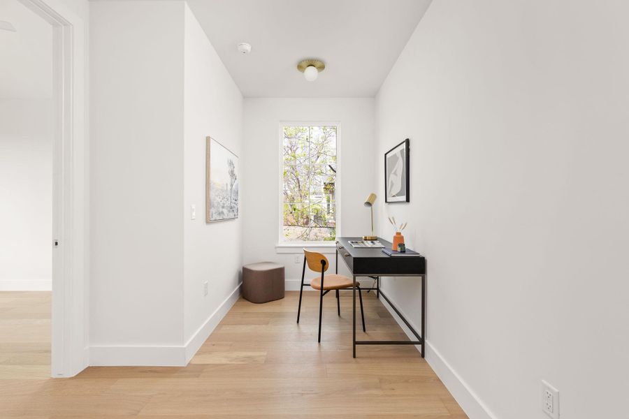 Office area featuring light wood finished floors and baseboards Office area featuring light wood finished floors and baseboards