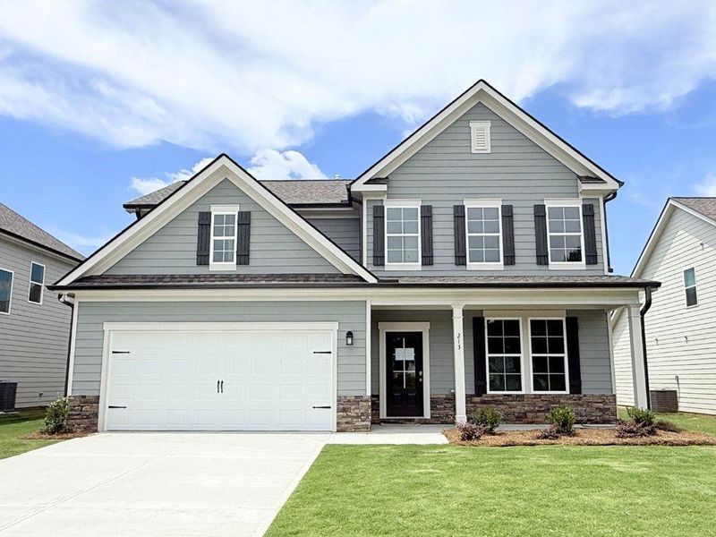 Front exterior of a new home in Sutton’s Landing, Statham, GA, highlighting curb appeal (Image 22). Front exterior of a new home in Sutton’s Landing, Statham, GA, highlighting curb appeal (Image 22).