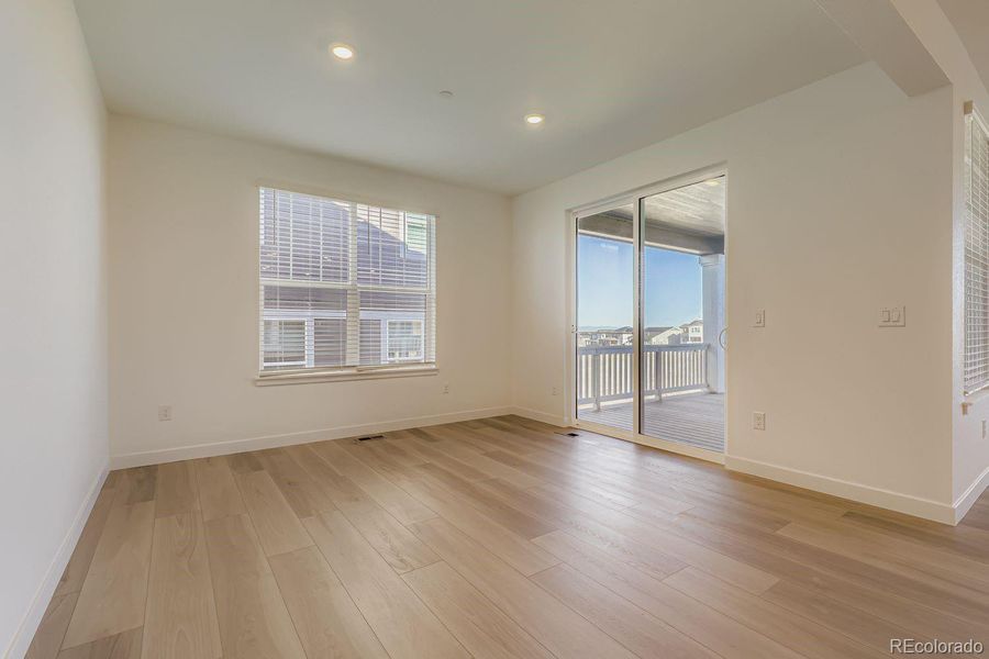 Spacious, unfurnished interior of a new home in Sunset Village: The Grand Collection, Erie (Image 9).