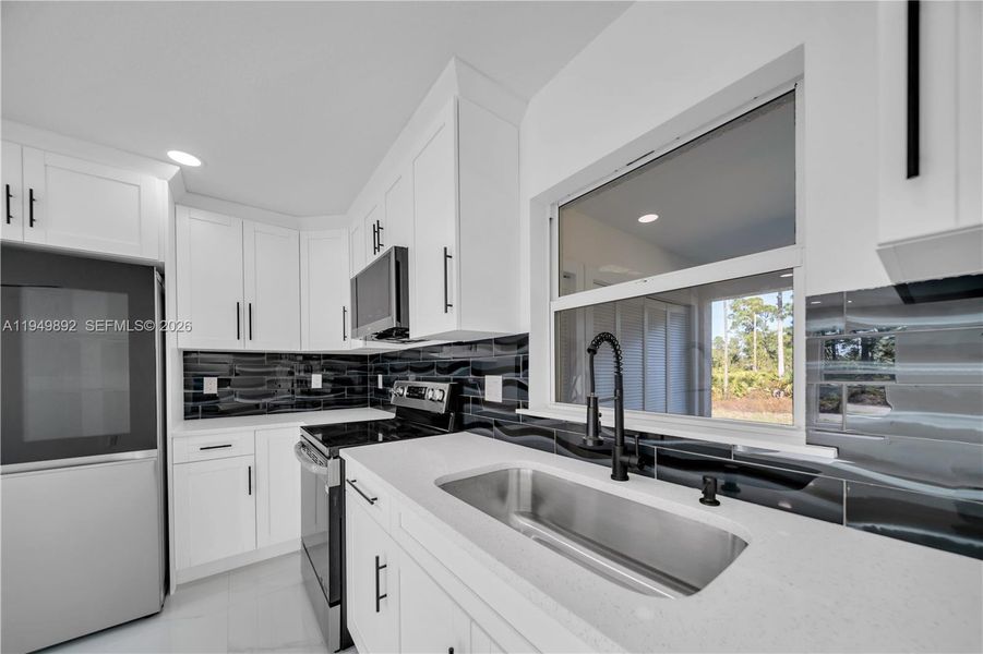 Furnished interior view inside a new home in , Lehigh Acres (Image 8).