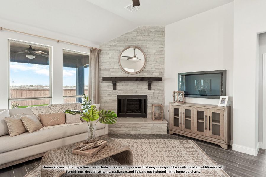 Living room with floor-to-ceiling stone fireplace, vaulted ceiling, large windows, and dark tile floors Living room with floor-to-ceiling stone fireplace, vaulted ceiling, large windows, and dark tile floors
