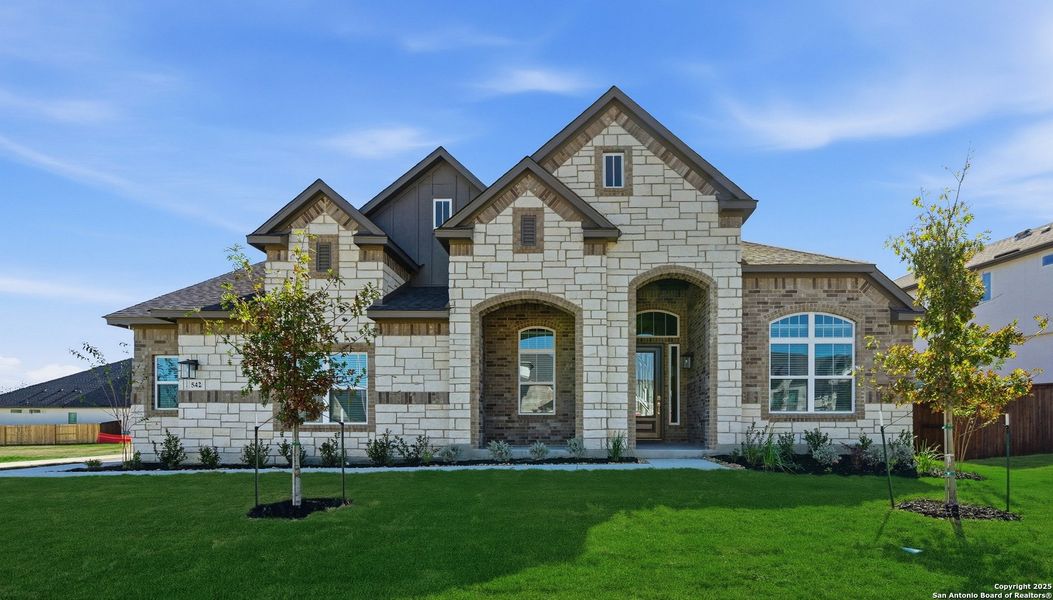 Front exterior of a new home in Mesa Western, Cibolo, TX, highlighting curb appeal (Image 2).