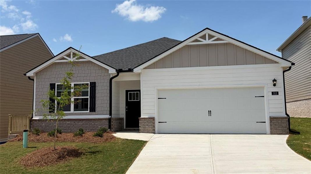Front exterior of a new home in Twin Lakes, Hoschton, GA, highlighting curb appeal (Image 1). Front exterior of a new home in Twin Lakes, Hoschton, GA, highlighting curb appeal (Image 1).
