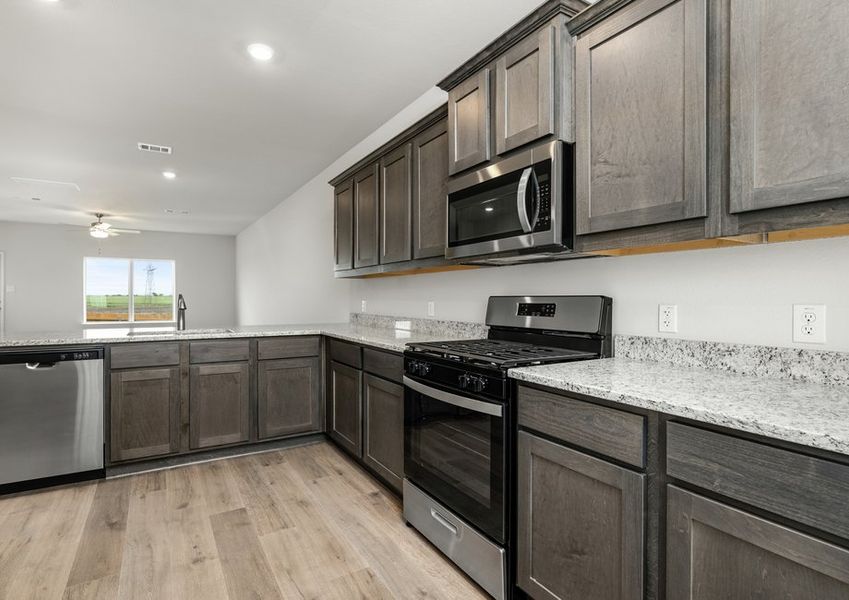 The kitchen has sprawling granite countertops.