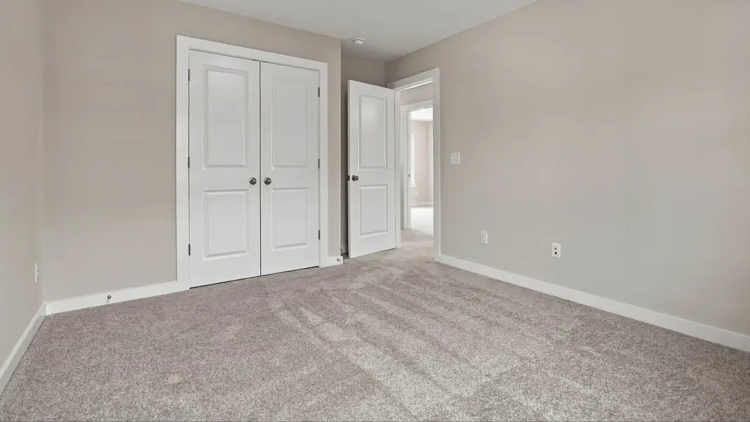 Convenient double door closet in secondary bedroom for storage space Convenient double door closet in secondary bedroom for storage space