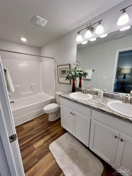 Representative furnished interior of a home built from the Plan 1454 by Adams Homes in Westpointe Place, Pensacola (Image 13).