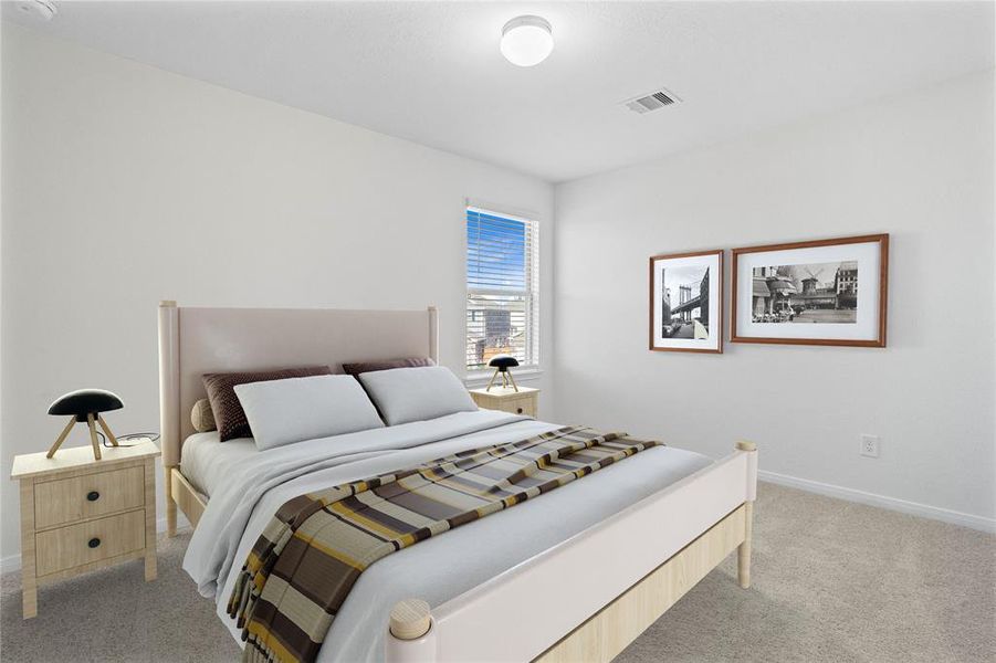 Secondary bedroom features plush carpet, custom paint and a large window with privacy blinds.