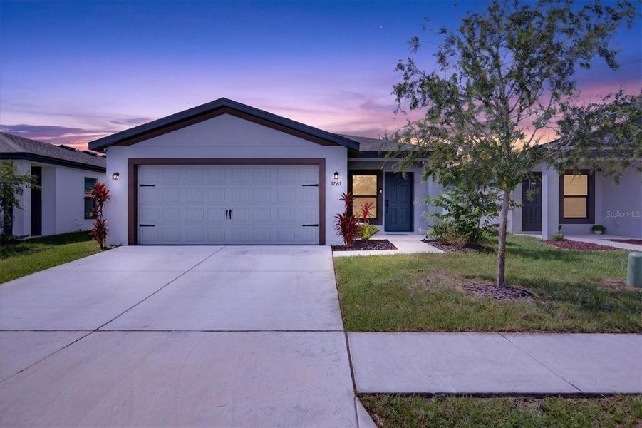 Front exterior of a new home in , Tampa, FL, highlighting curb appeal (Image 26).