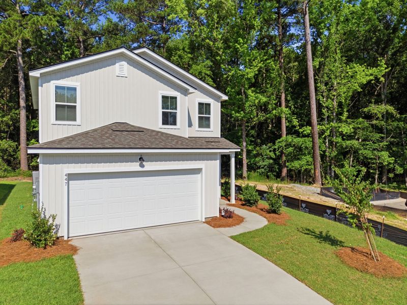 Front exterior of a new home in Grand Arbor, Blythewood, SC, highlighting curb appeal (Image 18).