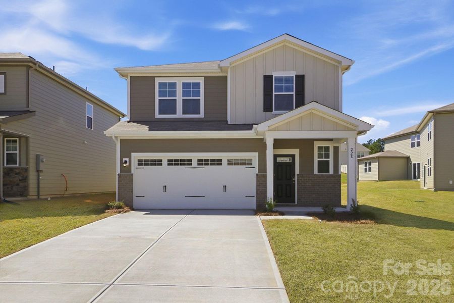 Front exterior of a new home in The Meadows at Asbury Ridge, York, SC, highlighting curb appeal (Image 2). Front exterior of a new home in The Meadows at Asbury Ridge, York, SC, highlighting curb appeal (Image 2).