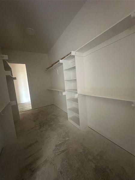 Primary closet conveniently connects to the utility room