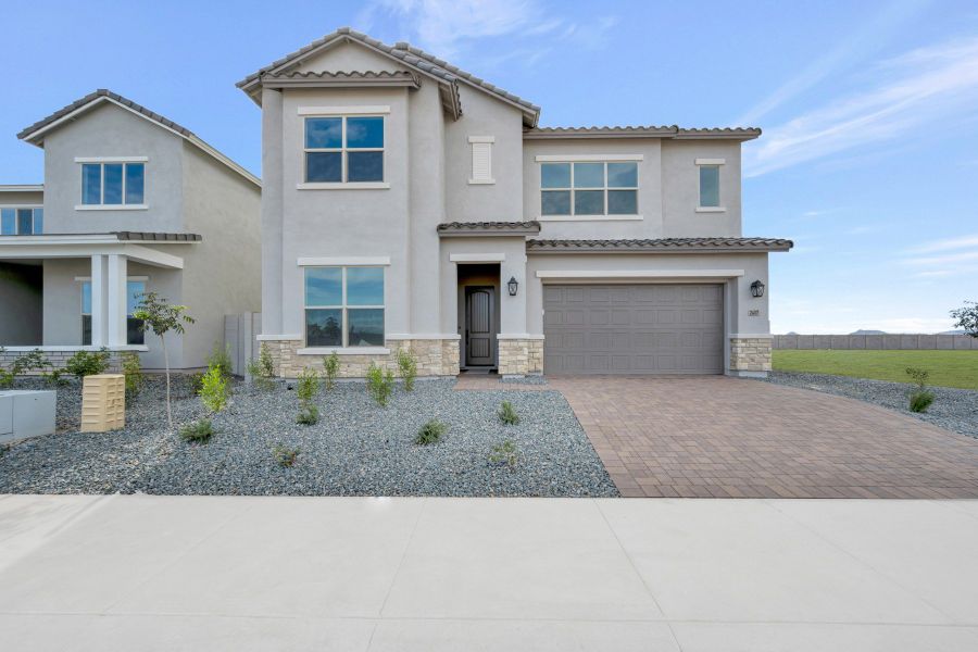 Front exterior of a new home in Tavolo at Soleo, San Tan Valley, AZ, highlighting curb appeal (Image 1). Front exterior of a new home in Tavolo at Soleo, San Tan Valley, AZ, highlighting curb appeal (Image 1).