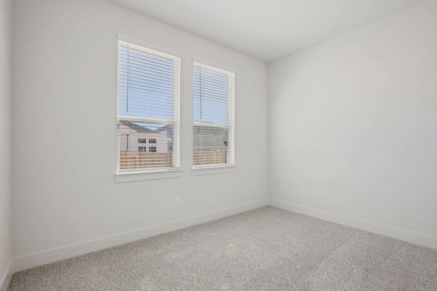 Representative unfurnished interior of a home built from the Draco by Chesmar Homes in The Grove at Blackhawk, Pflugerville (Image 15).