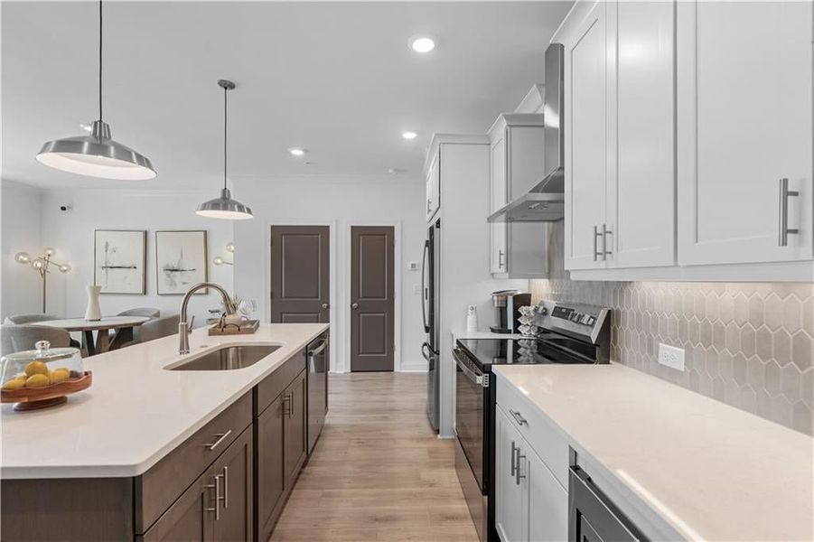 Kitchen features stainless steel GE Appliances *Images shown are from a decorated model of the same floor plan. Design selections and color packages will vary by home.*