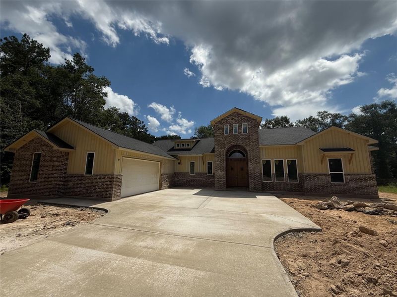 Front exterior of a new home in , Splendora, TX, highlighting curb appeal (Image 2). Front exterior of a new home in , Splendora, TX, highlighting curb appeal (Image 2).