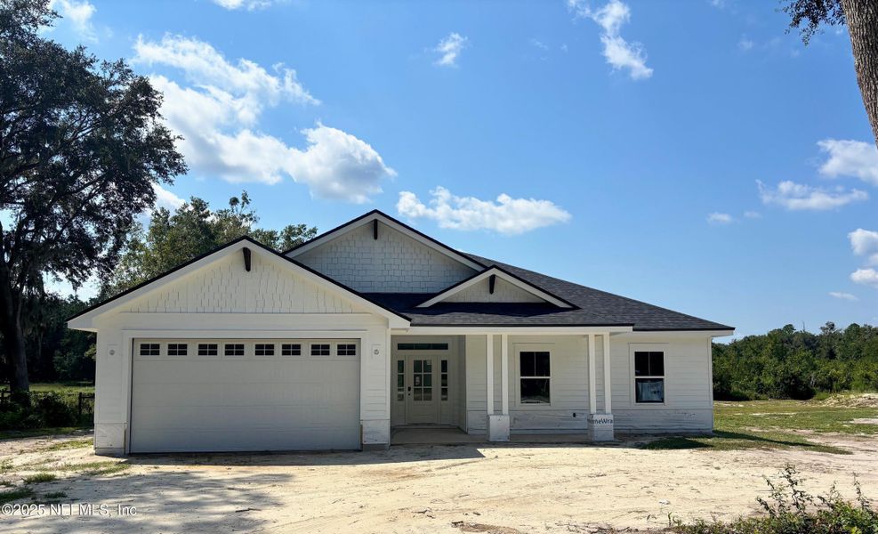 Front exterior of a new home in , Melrose, FL, highlighting curb appeal (Image 14). Front exterior of a new home in , Melrose, FL, highlighting curb appeal (Image 14).