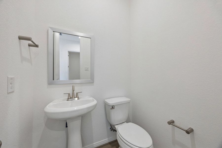 Half bathroom. Sample product photo. Actual exterior and interior selections may vary by homesite. Photo may be virtually staged.