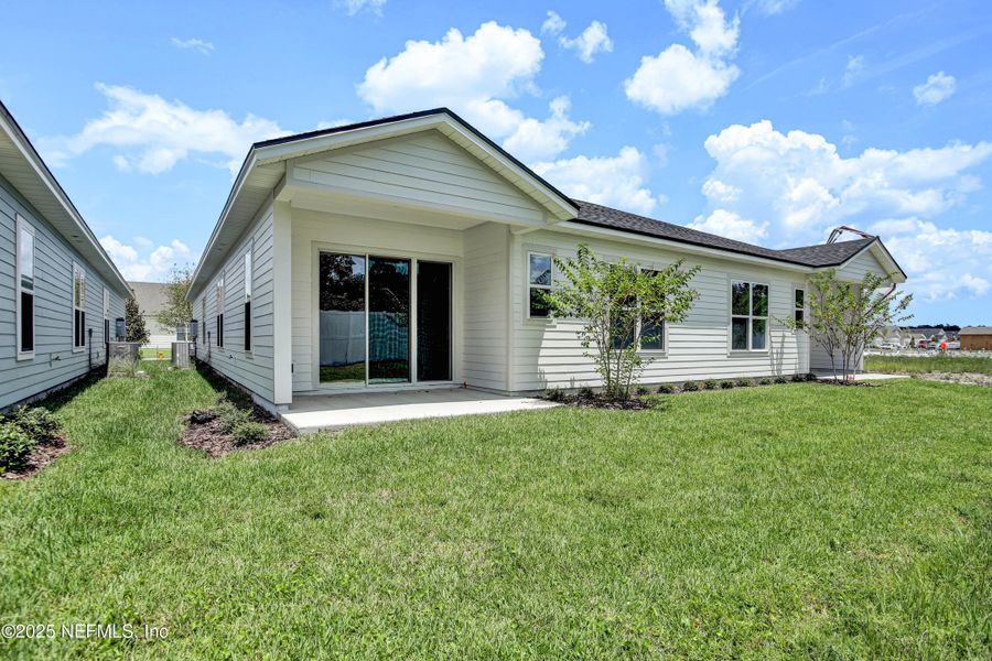 Front exterior of a new home in Everlake at Mandarin, Jacksonville, FL, highlighting curb appeal (Image 26).