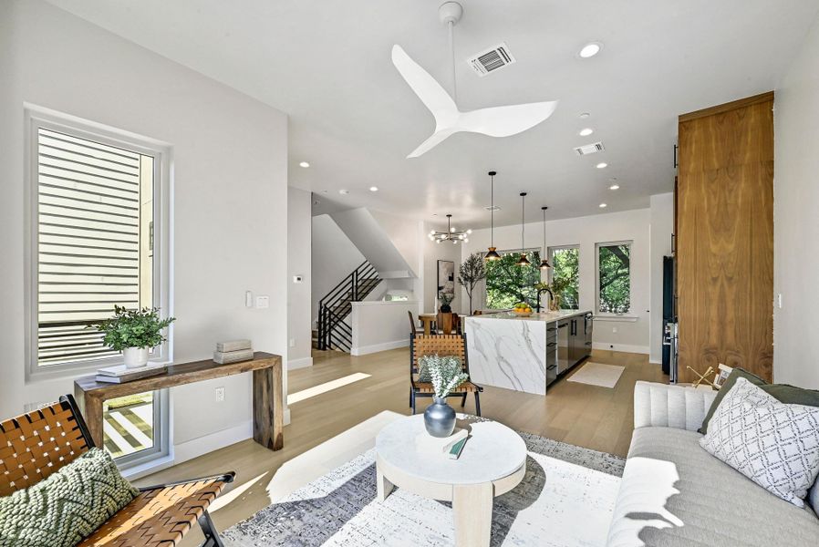 2nd Floor Open Living area with plenty of space for seating. (This is Unit #2 - each Unit has the same layout, however a few differing details such as light fixtures, custom cabinet/backsplash/tile colors)
