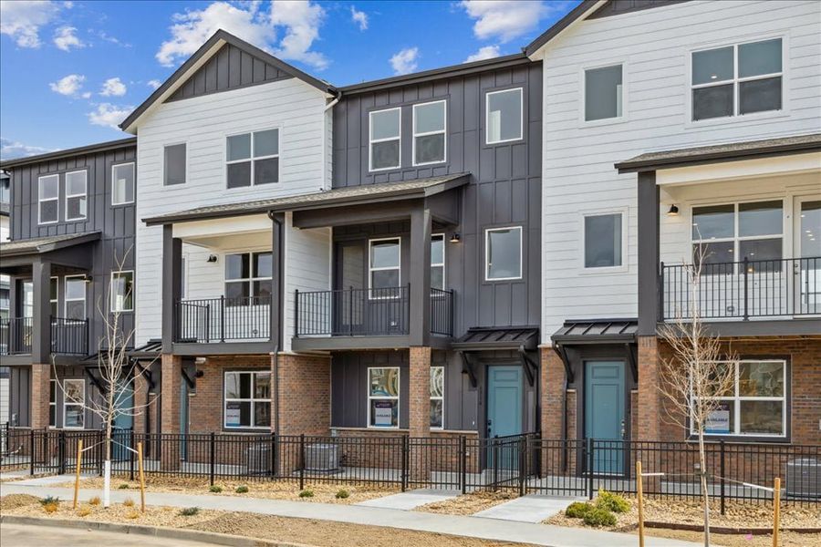 Front exterior of a new home in Atlantic Collection at The Townes at Skyline Ridge, Castle Pines, CO, highlighting curb appeal (Image 27). Front exterior of a new home in Atlantic Collection at The Townes at Skyline Ridge, Castle Pines, CO, highlighting curb appeal (Image 27).