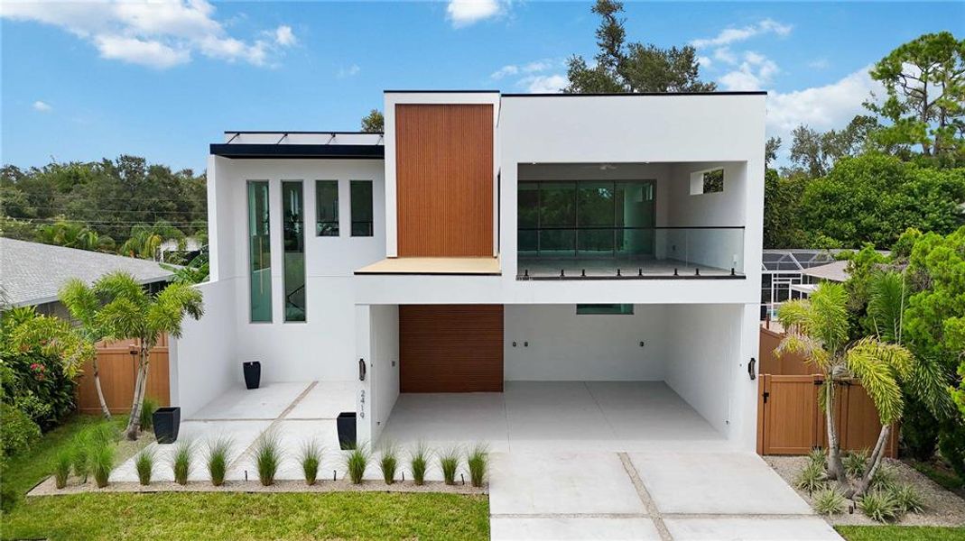 Front exterior of a new home in , Sarasota, FL, highlighting curb appeal (Image 28).