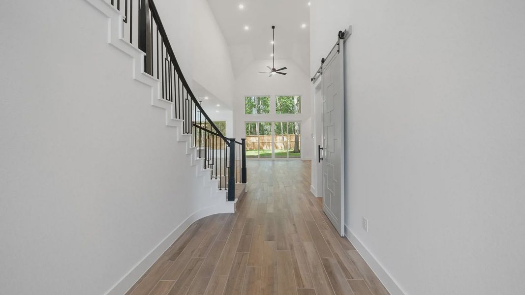 Representative unfurnished interior of a home built from the Waterloo by Chesmar Homes in Sofi Lakes, Katy (Image 19).