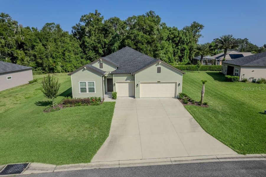 Front exterior of a new home in Grand Park North, Dunnellon, FL, highlighting curb appeal (Image 28).