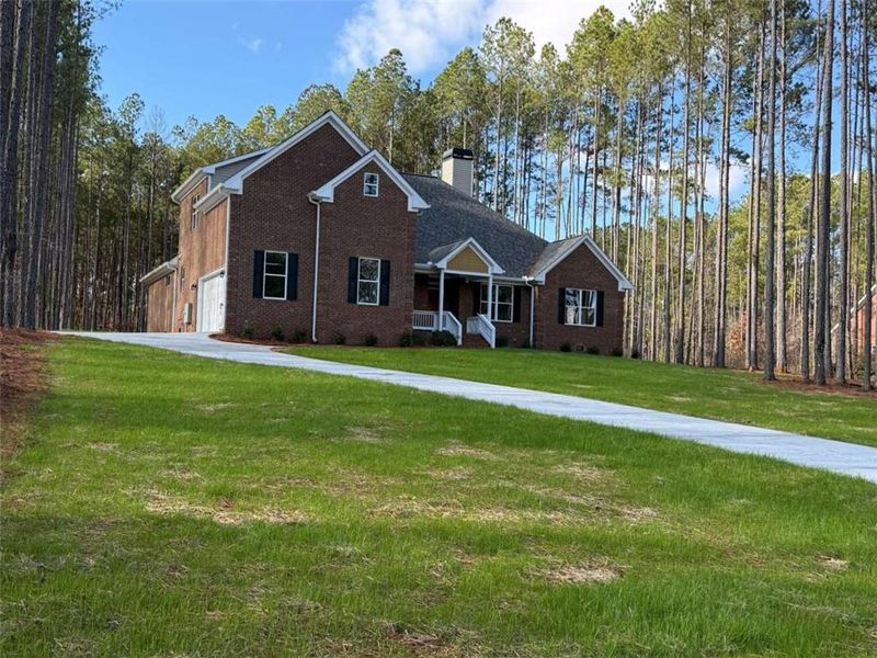 Front exterior of a new home in , Mansfield, GA, highlighting curb appeal (Image 2).