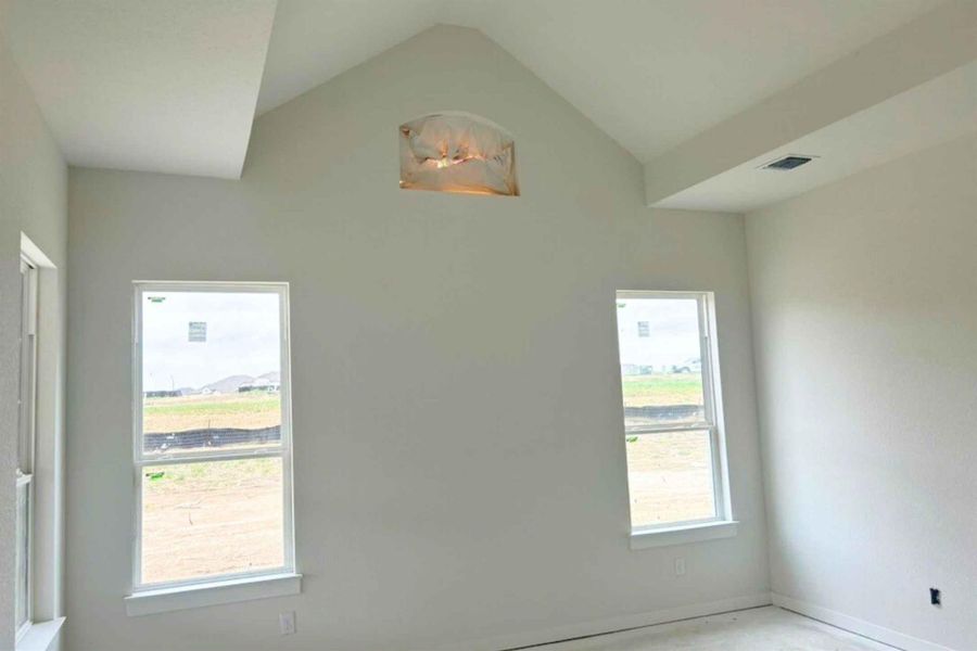 Empty room featuring baseboards