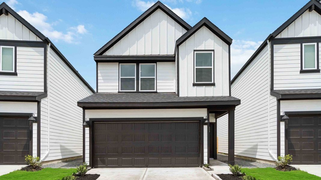 Front exterior of a new home in Grand West, Houston, TX, highlighting curb appeal (Image 1). Front exterior of a new home in Grand West, Houston, TX, highlighting curb appeal (Image 1).