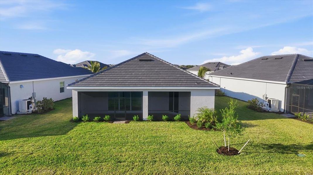 Front exterior of a new home in Heritage Landing, Punta Gorda, FL, highlighting curb appeal (Image 27).