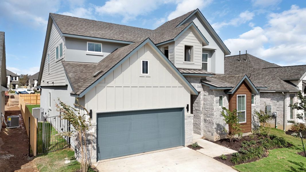 Front exterior of a new home in Santa Rita Ranch, Liberty Hill, TX, highlighting curb appeal (Image 35).
