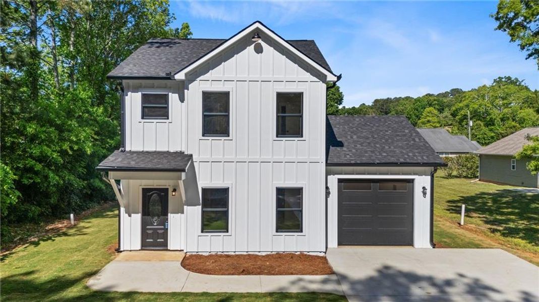 Front exterior of a new home in , Rome, GA, highlighting curb appeal (Image 1). Front exterior of a new home in , Rome, GA, highlighting curb appeal (Image 1).