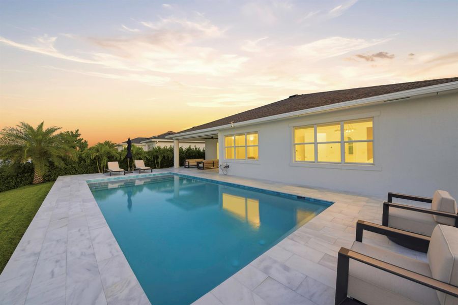 Exterior details and patio area of a home in Arden: The Waterford Collection, Loxahatchee (Image 4).