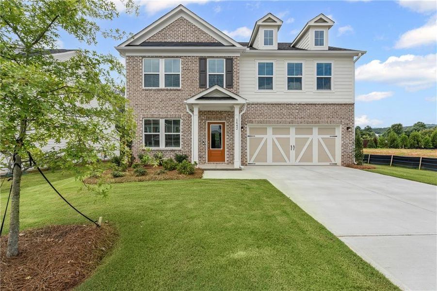 Front exterior of a new home in Berkeley Mill, Cumming, GA, highlighting curb appeal (Image 1).
