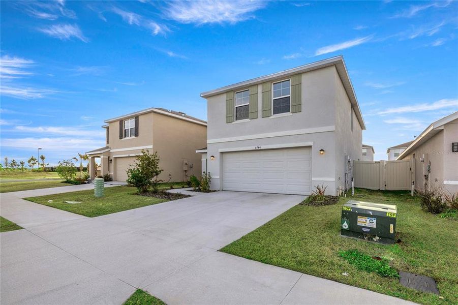 Front exterior of a new home in Ocala Crossings South, Ocala, FL, highlighting curb appeal (Image 24). Front exterior of a new home in Ocala Crossings South, Ocala, FL, highlighting curb appeal (Image 24).