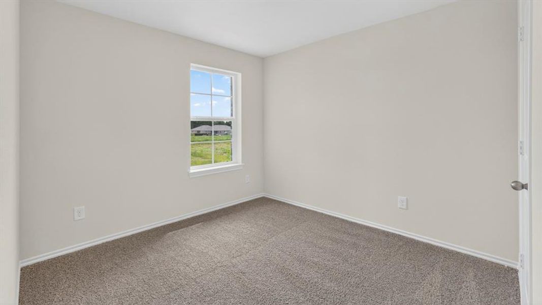 Room featuring light gray walls, gray carpet flooring, white baseboards, and a single window with white trim