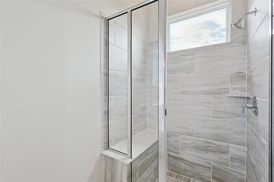 Bathroom featuring walk in shower