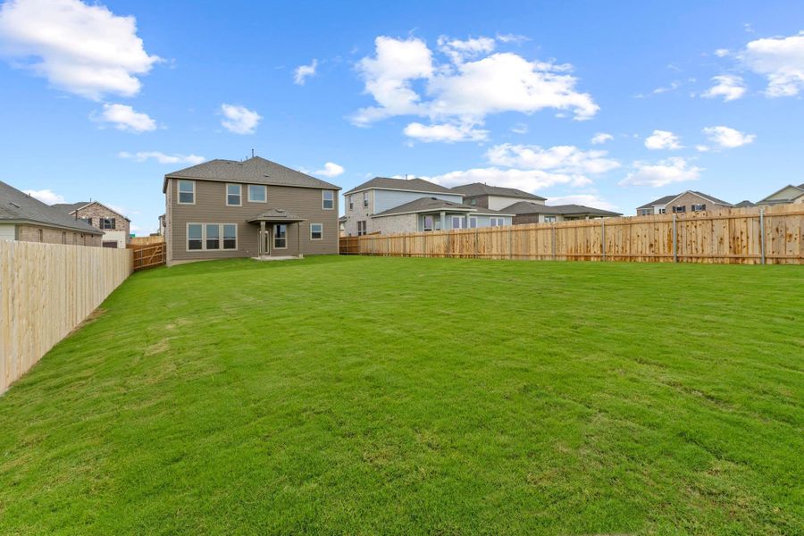 Front exterior of a new home in Salerno - Classic Collection, Round Rock, TX, highlighting curb appeal (Image 21). Front exterior of a new home in Salerno - Classic Collection, Round Rock, TX, highlighting curb appeal (Image 21).